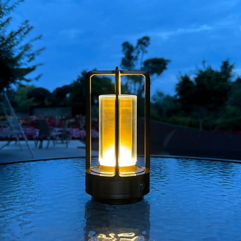 Portable Metal Table Lamp With 4000mAh Rechargeable Battery Cordless Outdoor Light on glass table in evening