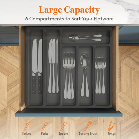 Sturdy Silverware Organizer With Lid For Drawer Or Countertop in open drawer with visible sections for knives, forks, and spoons.