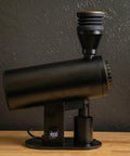 Killer Variable Speed Single Dose Coffee Grinder Equipped With 83mm Red Titanium Flat Burrs And A Rock Stable Burr Carrier That Crushes Beans Smoothly For Legit Espresso Pulls In Glossy Black viewed from the side, showcasing sleek design.