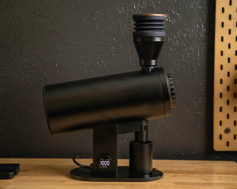 Killer Variable Speed Single Dose Coffee Grinder Equipped With 83mm Red Titanium Flat Burrs And A Rock Stable Burr Carrier That Crushes Beans Smoothly For Legit Espresso Pulls In Glossy Black viewed from the side, showcasing sleek design.