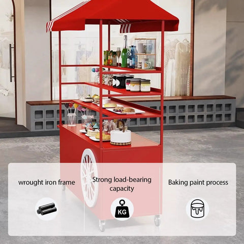 Kickass Rolling Cart With Red Striped Canopy And Wide Iron Top Heavy Duty Portable Vendor Stand On Smooth Casters With Lower Shelf For Street Food Sellers At Outdoor Festivals, featuring wrought iron frame and strong load-bearing capacity.