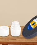8 Piece Reducing Bushing Adapters For Bench Grinder Wheels Set 2 Sets Included Four Bushing Sizes For Three Quarter Inch Wheels Inner Diameters One Half Inch Five Eighths Inch Three Quarters Inch And One Inch To One And A Quarter Inch Plastic, white adapters beside wheel