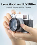 Hands holding camera fitted with 2in1 Pro Grade Metal Lens Hood With UV Filter For Fujifilm X100V X100VI Cameras
