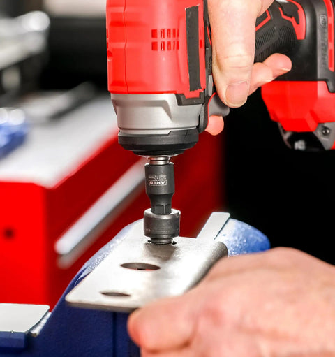 Using a Nine Piece Metric Impact Hex Driver Set With Chrome Moly Steel And Manganese Phosphate Coating on metal workpiece