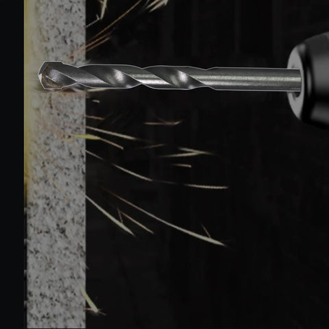 Close-up of a carbide tipped pilot drill bit from the 10 Piece Quarter Inch Pilot Drill Bit Set for Hole Saw Arbor drilling into masonry.