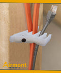 Airmont White Cable Stackers 50 Pack Multiple Cable Separator Wire Organizer holding multiple cables on wooden stud framing.