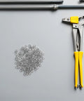 Stainless Steel Spring Lock Washers Set With Optimized Pressure Distribution 200 Pieces shown with pliers on gray surface