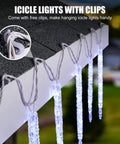 Outdoor Icicle Lights With Clips 20 Ft 100 LED Twinkling White Christmas String Lights attached to eaves