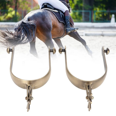 Two Pack Vintage Carved Zinc Alloy Horse Spurs For Roping And Equestrian Competition in front of a horse rider.