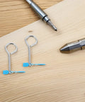 Fire Extinguisher Cotter Pins Replacement Kit with Easy Install Iron Pins and Plastic Tamper Seals 20 Pack on wooden surface