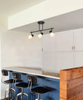 Modern 4 Light Kitchen Track Lighting Fixture with Glass Shades in Brushed Nickel Ceiling Mount Adjustable Heads over Kitchen Islands Sinks or Living Areas Slick Versatile Track Lighting Solution in a kitchen