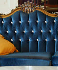 Top Notch Crystal Upholstery Tacks Set Of 60 Dope Diamond Furniture Buttons on a blue tufted sofa with gold pillow.