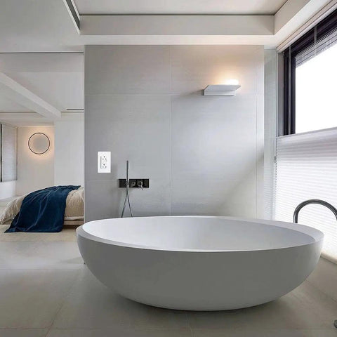 GFCI Weather-Resistant 20A 125V Outlet with Tamper-Resistant Receptacle installed in a modern bathroom with LED Indicator, ETL Listed, White.