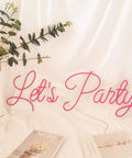 LED Neon Wall Sign For Party Decor 27 Inch Pink Light Sign Delivers A Totally Lit Glow For Weddings Engagements Birthdays Bedrooms Hotels Bars Clubs And More, Easy To Hang On Wall Windows Or Doors displayed on white background with green plant.