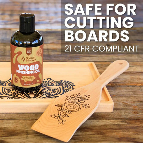 Straight Up Coconut Mct Wood Finishing Oil And Food Safe Cutting Board Sealer on wooden background with spatula and tray.