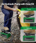 Technician using 10,000 Psi Air Hydraulic Pump with foot pedal and 6.6 ft hose on auto body machine beside large tractor wheel.