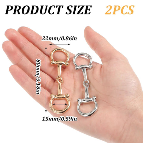 Hand holding two piece horse bit buckle set silk scarf buckle ring D ring snaffle bit buckles for women DIY snaffle horse jewelry.