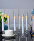 Battery Operated LED Flameless Candles With Timer, Outdoor Waterproof Candles in 3x4 3x5 3x6 Inch Sizes, 9 Pack displayed indoors