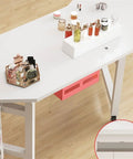 Top Tier Gaming Workspace And Home Office Computer Desk With A Spacious White Desktop Pc Table showcasing beauty products and storage.