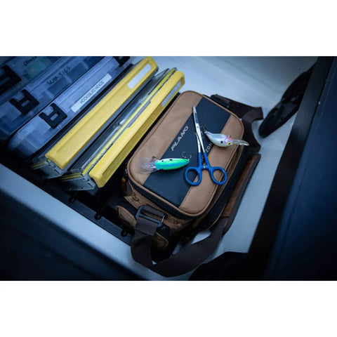 Guide Series 3500 Soft Tackle Bag With Five 3500 Stowaway Boxes, rugged 1680 Denier fabric, on a boat with tools.