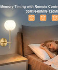 Gold Wireless Wall Sconces Set Of Two With Rechargeable Battery And Remote Features Three Tunable Color Temperatures Plus Twelve Rgb Modes For Chill Bedroom Or Hallway Ambience No Drills Needed And Super Fast Setup beside a sleeping person with soft light.