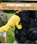 Two people hiking with large backpacks using sturdy bundle ropes to secure camping gear, visible in an outdoor setting