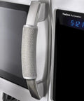 Gray fridge handle cover with Velcro straps displayed on a stainless steel microwave. Plush 5 Pack Refrigerator Door Handle Covers included.