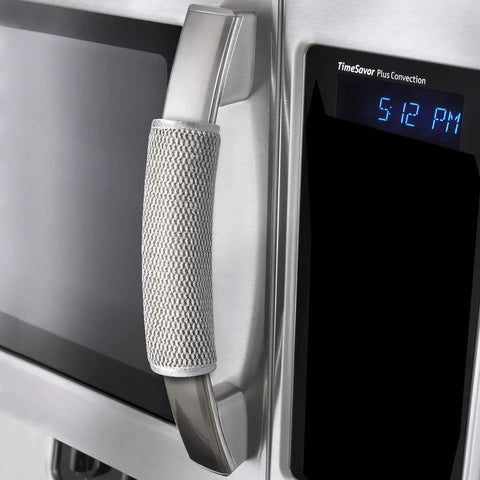 Gray fridge handle cover with Velcro straps displayed on a stainless steel microwave. Plush 5 Pack Refrigerator Door Handle Covers included.