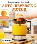 Elite Gourmet Citrus Juicer 1.2 L Capacity Black And Stainless Steel Electric Orange Lemon Squeezer in use with fresh juice