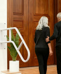 Rock Solid Outdoor Handrails For Front Porch Steps Heavy Duty U Shaped Stair Railing White aiding two seniors at entrance