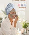 Woman smiling with a mask wearing blue Go To Rapid Dry Microfiber Hair Towel Wraps For Women Three Pack Turban Style Quick Dry Towels