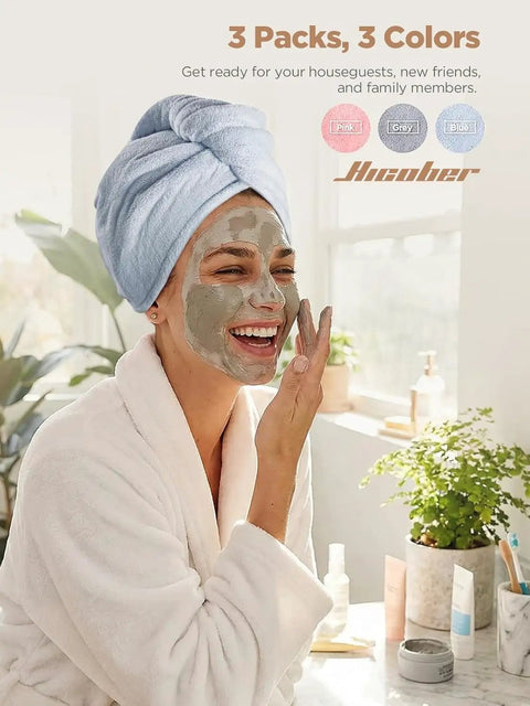 Woman smiling with a mask wearing blue Go To Rapid Dry Microfiber Hair Towel Wraps For Women Three Pack Turban Style Quick Dry Towels