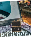 Three-Piece Survival Storage Case Set for Outdoor Junkies Ultra-Tough Shockproof and Sealed Organizer next to a tent