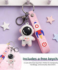 Cute astronaut keychain with removable pink strap featuring a rocket design, ideal for bags and everyday use.