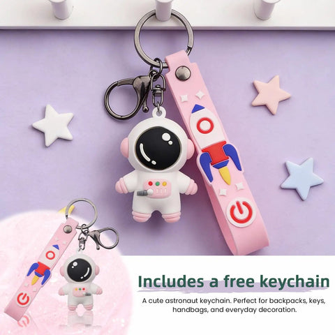 Cute astronaut keychain with removable pink strap featuring a rocket design, ideal for bags and everyday use.