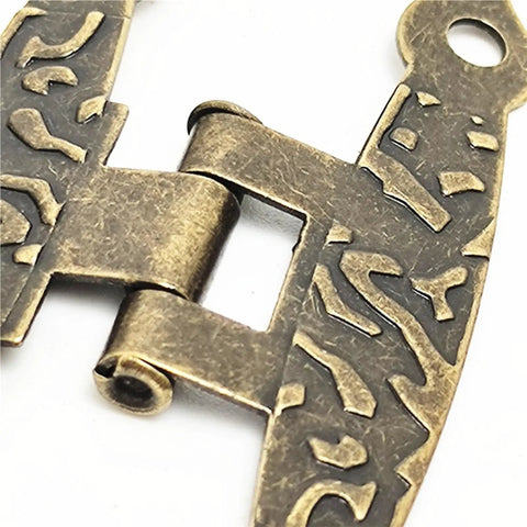 Close-up of 4Pcs Antique Vintage H Shaped Cabinet Door Hinges with decorative engravings for jewelry boxes and furniture decor.