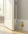 Magnetic Door Stop 2 Pack Heavy Duty Stainless Steel No Drill Wall Or Floor Mount With 3M Tape Or Screws Strong Magnet Keeps Doors Open Full Round Head Golden Finish installed on wall