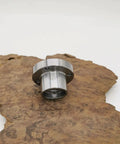 Two Inch Steel Faceplate for Wood Lathe with 1 8 TPI Thread on wood surface, showing four mounting holes