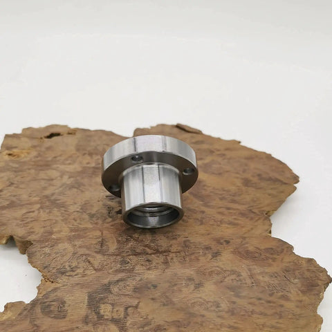 Two Inch Steel Faceplate for Wood Lathe with 1 8 TPI Thread on wood surface, showing four mounting holes