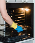 Person sliding Flat Style Oven Rack DG75-01001C For Range Stove Oven Replacement Heavy Duty into oven with gloves on