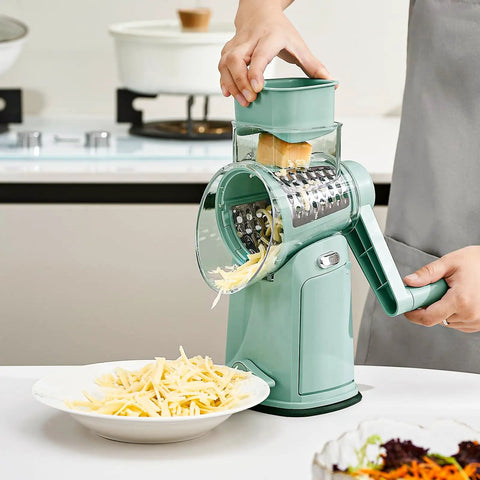Person using rotary cheese grater hand crank 5 in 1 mandoline slicer with 5 stainless steel blades and suction base on counter