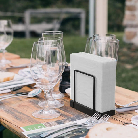 Table Top Napkin Holder Made of Bamboo and Iron, Standing Dispenser for Kitchen and Dining, Rustic Black Finish on a picnic table