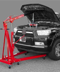 Zero Hassle 4000 Lbs Hydraulic Engine Hoist Shop Crane With Folding Frame And Reinforced Four Position Boom in use with a car