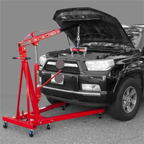 Zero Hassle 4000 Lbs Hydraulic Engine Hoist Shop Crane With Folding Frame And Reinforced Four Position Boom in use with a car