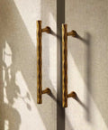Hammered Antique Brass Cabinet Pulls 5 Inch Center Hole 10 Pack Vintage Vibe Handles installed on cabinet doors