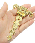 Hand holding Antique Gold Medieval Door Hinge from 4 Pcs 4.45 By 2.72 Inches T Strap Hinge Retro Carved Hardware for Barn Door Gate.