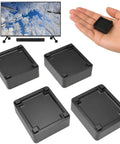 Four Pack Stackable TV Stand Riser Blocks With Half Inch Adjustable Height, showing risers and remote on hand next to TV.