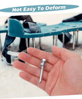 Hand holding spike next to metal lawn aerator shoes with spikes, part of the Metal Lawn Aerator Shoes With Spikes 20 Piece Set For Quick Soil Aeration.
