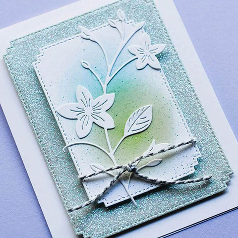 Greeting card showcasing 7 Piece Rectangle Frame Die Cut Set With Stitched Nesting Frames for DIY scrapbooking, featuring floral design.
