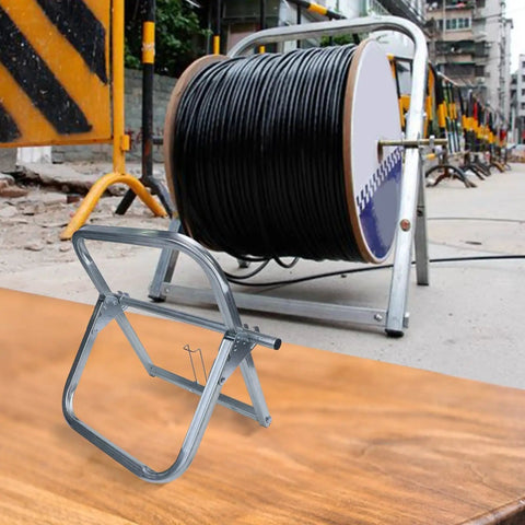 Heavy Duty Steel Cable Reel Dispenser Rack Delivers Tangle Free Cord Management With Smooth Rolling Base on job site with black cable.